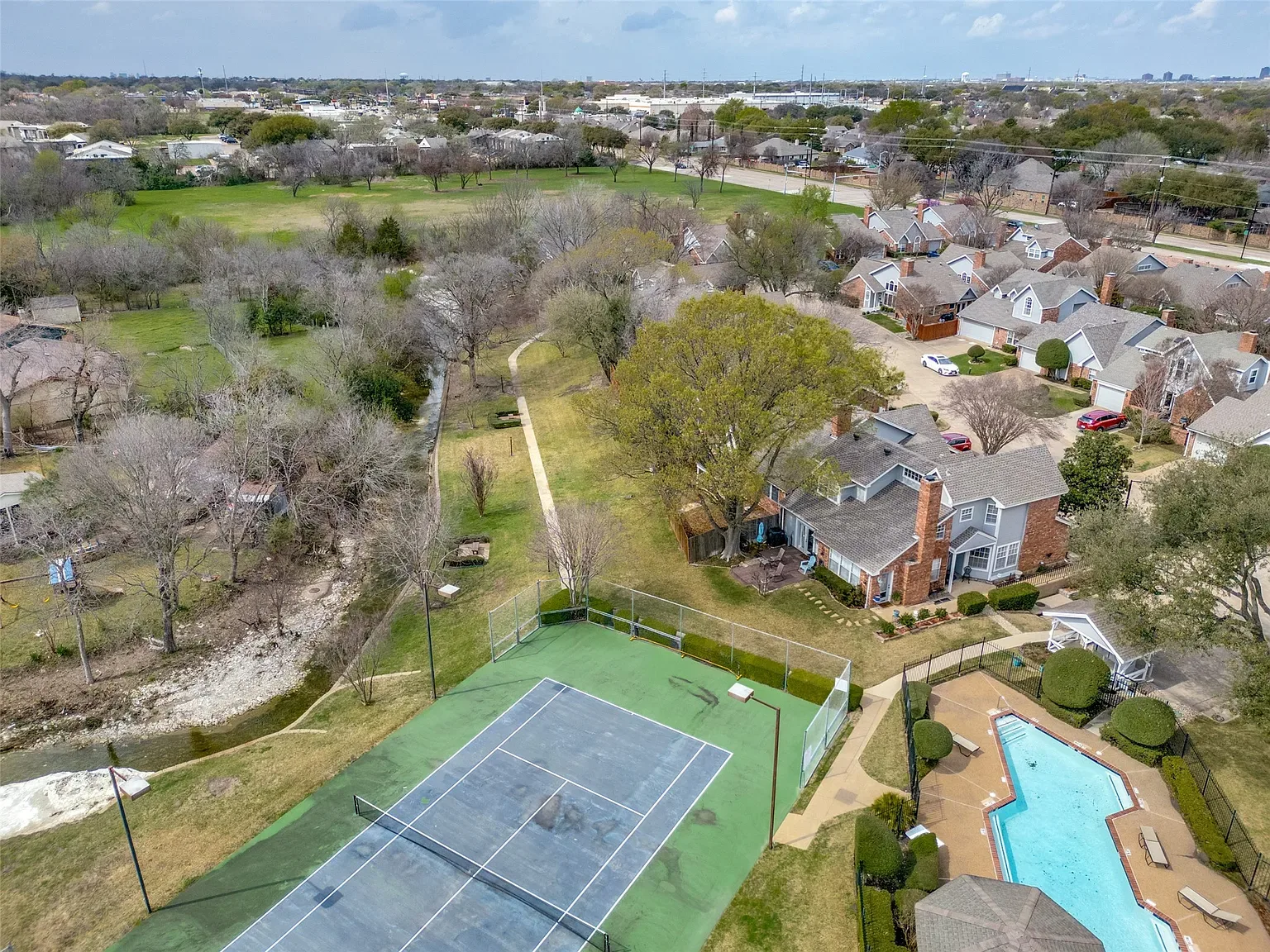 Arbor Creek home with mature trees